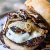 The Campirana Burger · Topped with mushrooms, swiss cheese, and BBQ sauce.