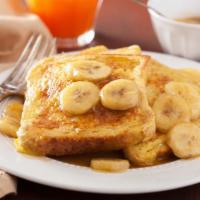 Banana French Toast · Custard-dipped, thick-cut brioche bread topped with bananas, whipped butter, and syrup.