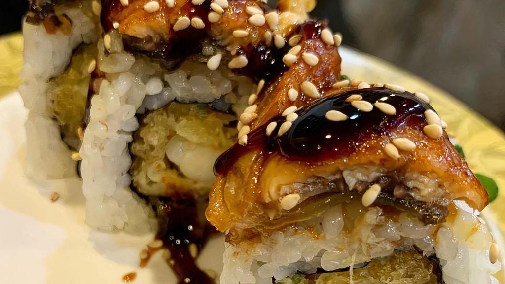 Dragon Roll · Fresh shrimp tempura and cucumber, topped with unagi and drizzled with sweet unagi glaze and toasted sesame seeds.