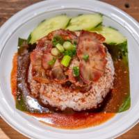 Kao Moo-Dang · Roasted pork served with jasmine rice and homemade thick seasoned gravy sauce.
