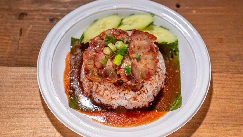 Kao Moo-Dang · Roasted pork served with jasmine rice and homemade thick seasoned gravy sauce.