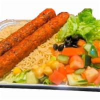 Kofta Kebab Over Rice Platter · Chicken kofta kebab served over brown basmati with choice of salad and any of the sauces.