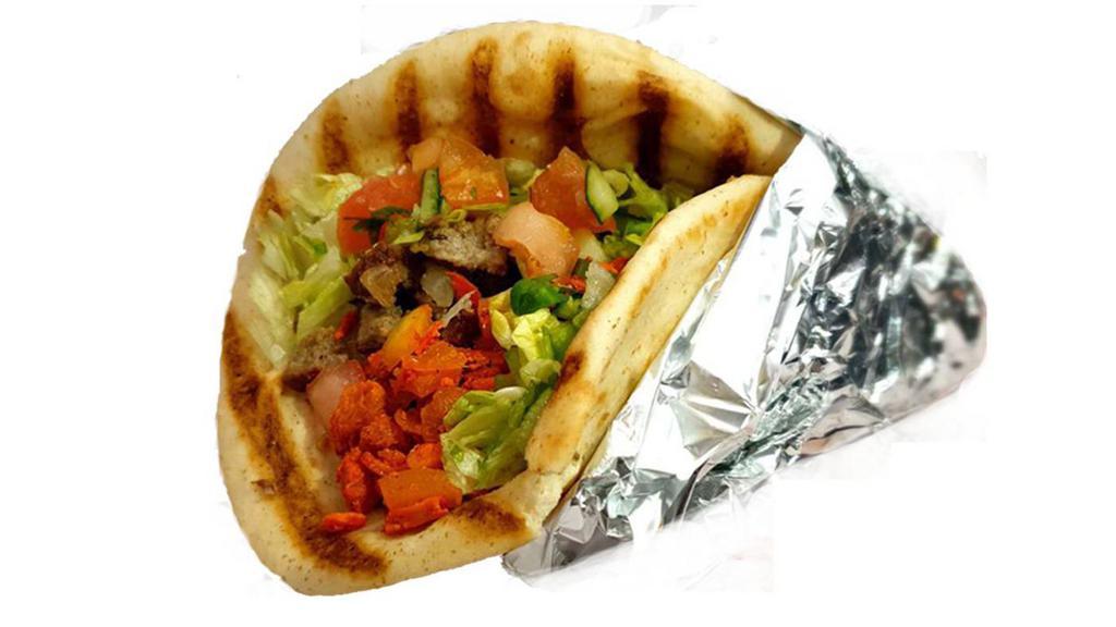 Combo Gyro · Grilled chicken and lamb served on a pita with choice of salad and any of the Shah's sauces.