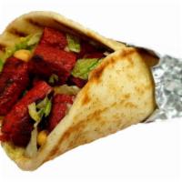 Kofta Kebab On Pita · Kabab made with ground chicken and herbs, served on pita with choice of salad and any shahs ...