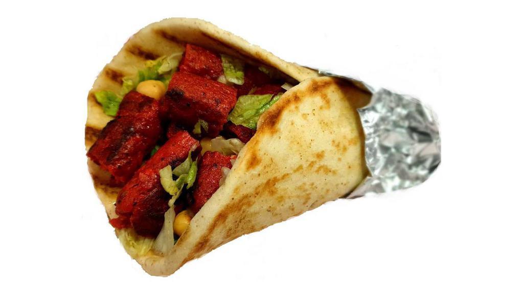 Kofta Kebab On Pita · Kabab made with ground chicken and herbs, served on pita with choice of salad and any shahs sauces.