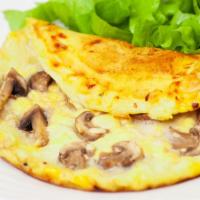 Mushrooms, Onion & Swiss Cheese Omelette · Sizzling hot Omelette made with Mushroom, Swiss cheese, and Onions. Served with a side of ho...