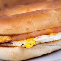 Ham, Egg, & Cheese Sandwich · Delicious Breakfast sandwich topped with 2 cooked eggs, ham, and melted cheese. Served on cu...