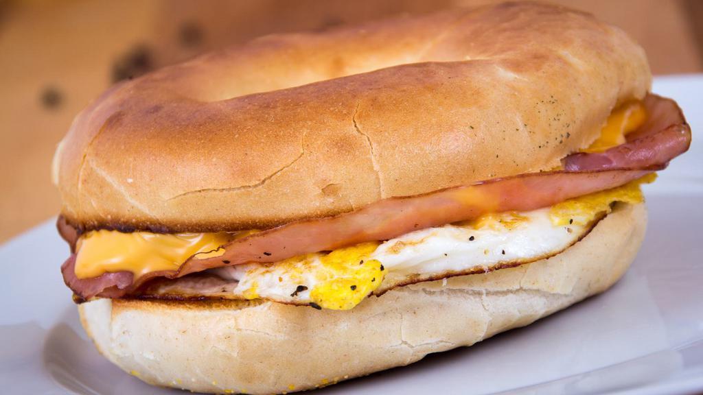 Ham, Egg, & Cheese Sandwich · Delicious Breakfast sandwich topped with 2 cooked eggs, ham, and melted cheese. Served on customer's choice of bread.