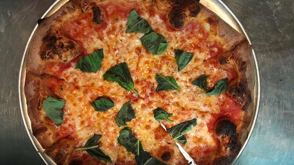 Margherita Pizza · Tomato sauce, fresh Mozzarella cheese, and basil.