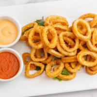 Crispy Fried Calamari · Spicy marinara and chipotle sauces.
