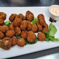 Garlic Mushrooms · Fresh button mushrooms, lightly battered, flash fried, served w/house made garlic mayo