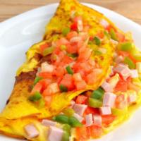 Western Omelet Wrap · An omelet served with scrambled eggs, boars head ham, multi-color bell peppers and onions.