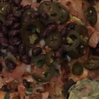 Nachos Grande · Guacamole, pico De gallo, sour cream, jalapenos, black beans and a blend of cheese. Add prot...