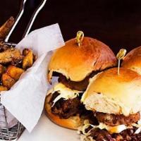 3 Pulled Pork Sliders · BBQ sauce, onion rings, coleslaw and light chipotle aioli.