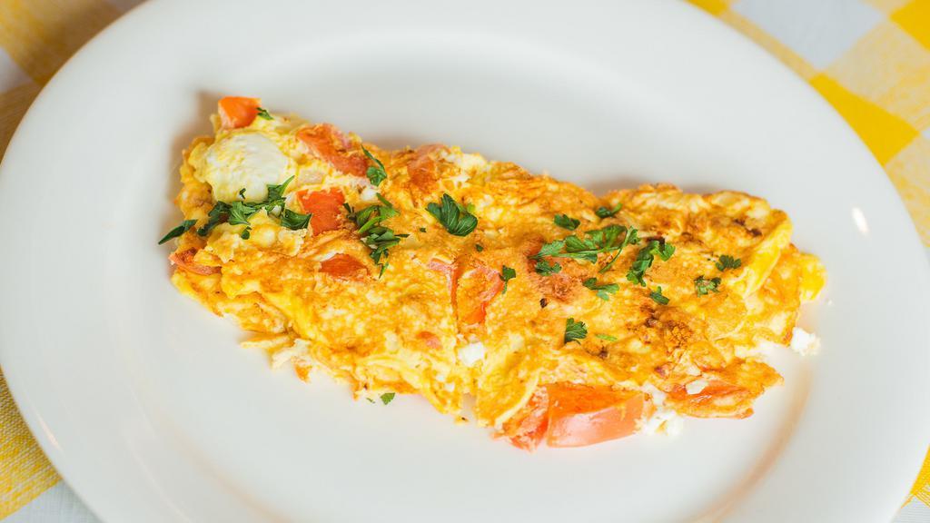 The Greek Omelet · 3 eggs, Tomatoes, Feta, and Onions.