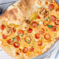 The Hoboken Pizza · Half calzone, half pizza pie — roni cups, mozzarella, homemade vodka sauce, garlic knot crust.