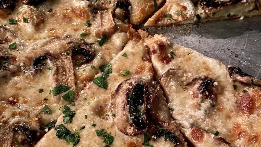 Truffle Mushroom Pizza · Truffled marsala cream sauce, cremini & button mushrooms, fresh mozzarella.