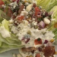Wedge Salad · Iceberg, roasted corn, crispy applewood bacon, crumbled blue cheese, tomato, blue cheese dre...