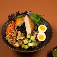 Tofu Steak Bowl · Seared soy-marinated thick-cut tofu served with wild rice, diced cucumber, carrot, five-spic...