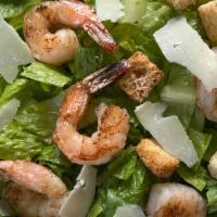 Shrimp Ceasar Salad · Shrimp served on a bed of Romaine lettuce, shaved pecorino romano, herbed croutons, with a s...