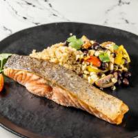 Salmon Quinoa Bowl · Roasted Salmon served on a quinoa bowl topped with beans, jalapeño, roasted corn , and cherr...
