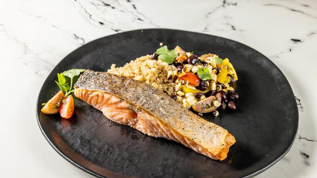 Salmon Quinoa Bowl · Roasted Salmon served on a quinoa bowl topped with beans, jalapeño, roasted corn , and cherry tomatoes