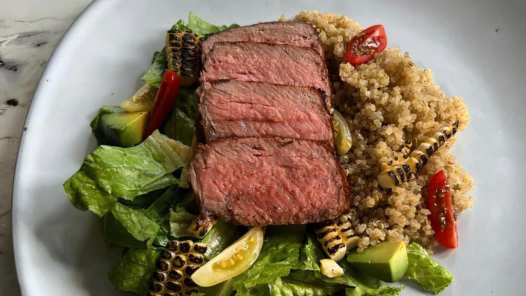 Steak Quinoa Bowl · Steak served on quinoa, corn, tomatoes, black beans, and lima beans.
