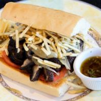 Vegan Pan Con Bistec · Breaded or grilled portabella mushroom, grilled onions, sliced tomato, and shoestring potato...