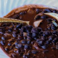 Black Bean Soup (Vegan) · Black bean soup with onion, and green bell pepper in a vegetable-based broth.