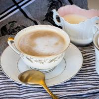 Café Con Leche · Sweetened espresso with steamed milk. (reg./decaf).