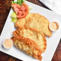 Vegetable Empanada · Mushrooms, spinach, broccoli, onions and peppers.