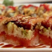Sushi Cake Roll · Eel, salmon, avocado, spicy tuna, crunchy and salmon no seaweed.