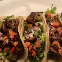 Carne Asada Tacos · Grilled steak, Onions, Cilantro & pico de gallo . with 3 corn tortillas