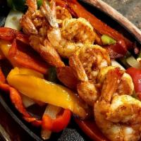 Shrimp Fajitas · Shrimp, Roasted peppers, onions, tomatoes, Guacamole, Sour Cream, Pico De Gallo house sizzli...