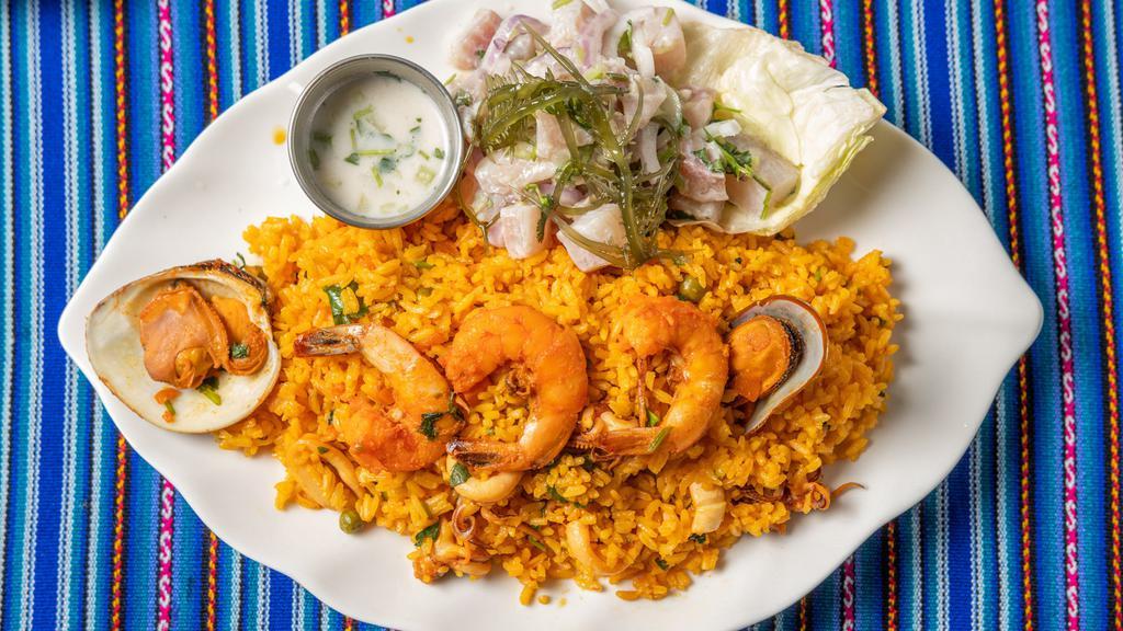 Arroz Con Mariscos / 43. Seafood With Rice · Arroz de paella al estilo peruano. / Peruvian style paella rice.