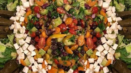 Greek Salad · Romaine Lettuce, Grape tomato, Cucumbers, Kalamata Olives, Feta Cheese dressing with Red Wine Vinaigrette.