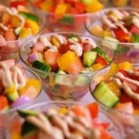 Israeli Salad Bowl · Cucumbers, tomatoes, parsley, chickpeas, kalamata olives, radishes, baked falafel, tahini dr...
