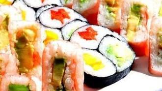 Chapulin Roll · Fried Kani, cucumber, avocado, mango, scallions, topped with spicy tuna.