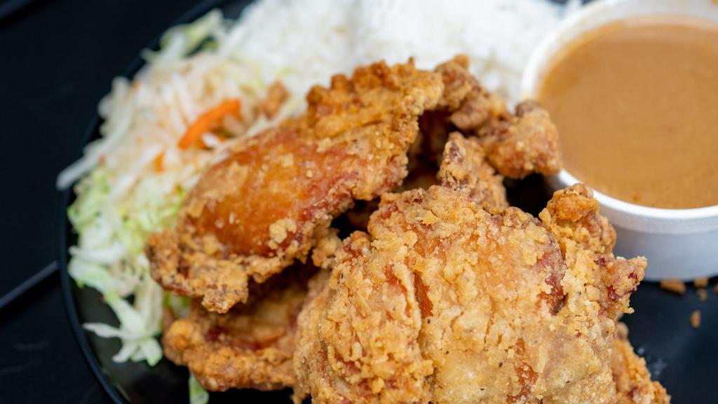 Fried Chicken & Gravy Rice Plate · Buttermilk fried chicken, gravy, steamed rice, tossed green salad.