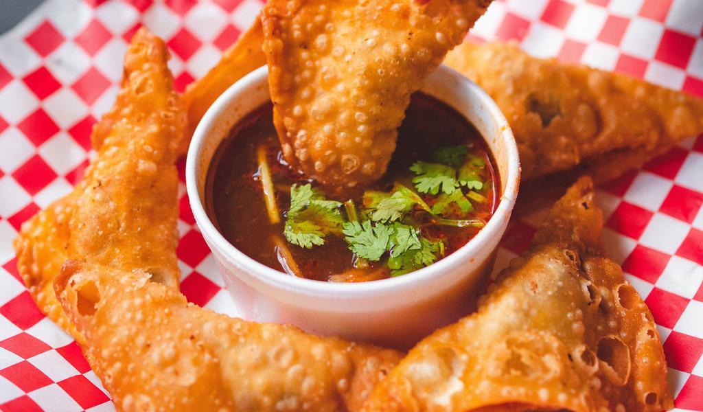 6 Fried Birria Wonton · Deep fried wonton filled with 18-hour smoked brisket and cheese, comes with spicy and tangy consomme dipping sauce.