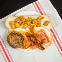 Hungry Man · Three eggs with ham, bacon, sausage, cheese and home fries on a hero.