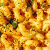 Gourmet Mac & Cheese · Creamy & cheesy topped with toasted bread crumbs & parsley.