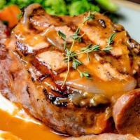 Karver'S Pork Chop Scarpiello · Grilled & sauteed with brandy gravy, sausage, peppers, onions. Served with mashed potatoes &...