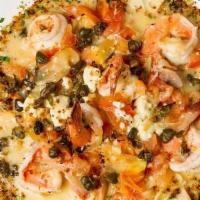 Shrimp Santorini · Sauteed shrimp with feta, tomatoes, onions, & capers in a white wine sauce over angel hair p...