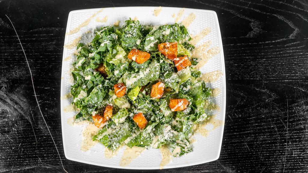 Kale Caesar · Parmesan, Homemade croutons, kale & romaine
with creamy caesar dressing.