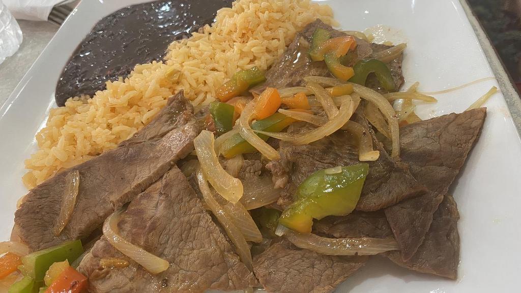 Bistec A La Mexicana · Steak sautéed with onions, tomato and jalapeno. Served with rice and beans.