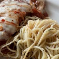 Breast Of Chicken Parmigiana · Breaded chicken cutlet with mozzarella and tomato sauce.