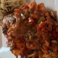 Boneless Chicken Cacciatore · Chicken with peppers, onions, and marinara sauce.
