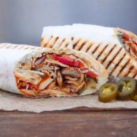Chicken Shawarma Wrap · Thin slices of marinated chicken served in a pita pocket with lettuce, tomatoes and special ...