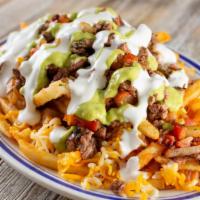 Steak & Cheese Fries · Mix of steak and cheese on basket of fries.